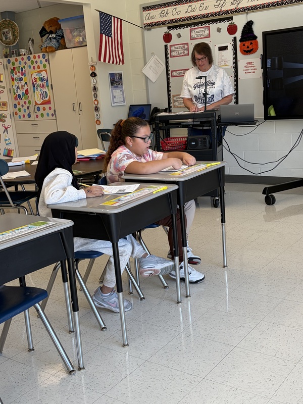 students sitting at desks working on assignment
