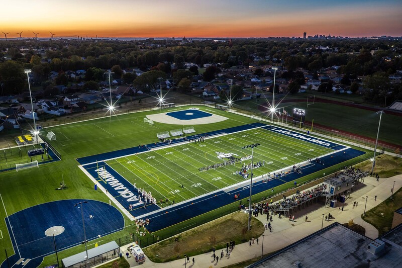 overhead photo of ribbon cutting at athletic fields