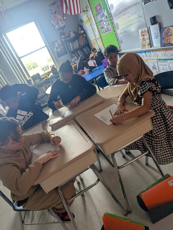 Students work in class.