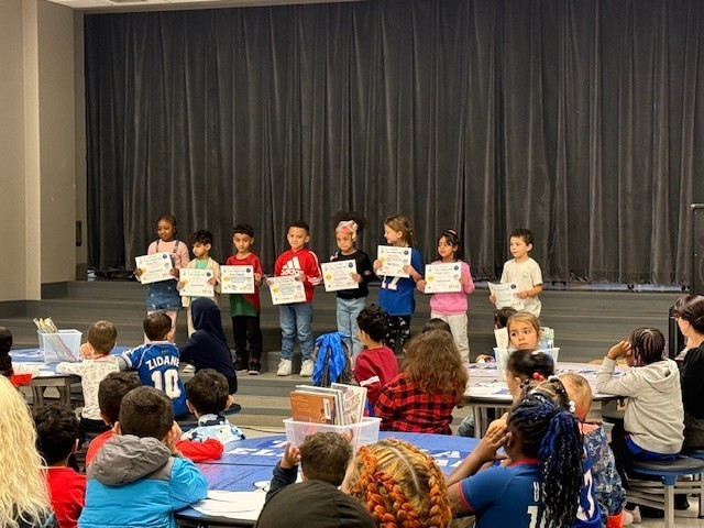 Families gather in cafeteria.