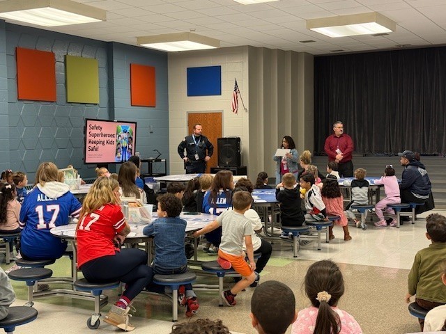 Families gather in cafeteria.