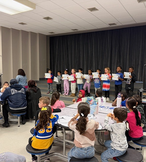Families gather in cafeteria.