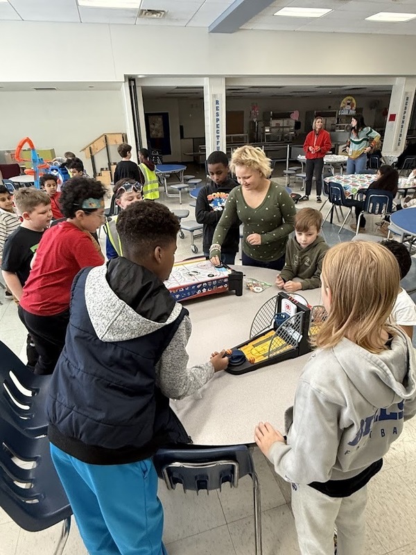 Students play at birthday celebration.