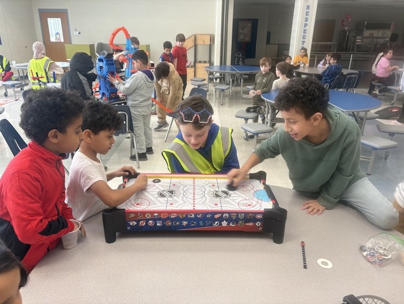 Students play at birthday celebration.
