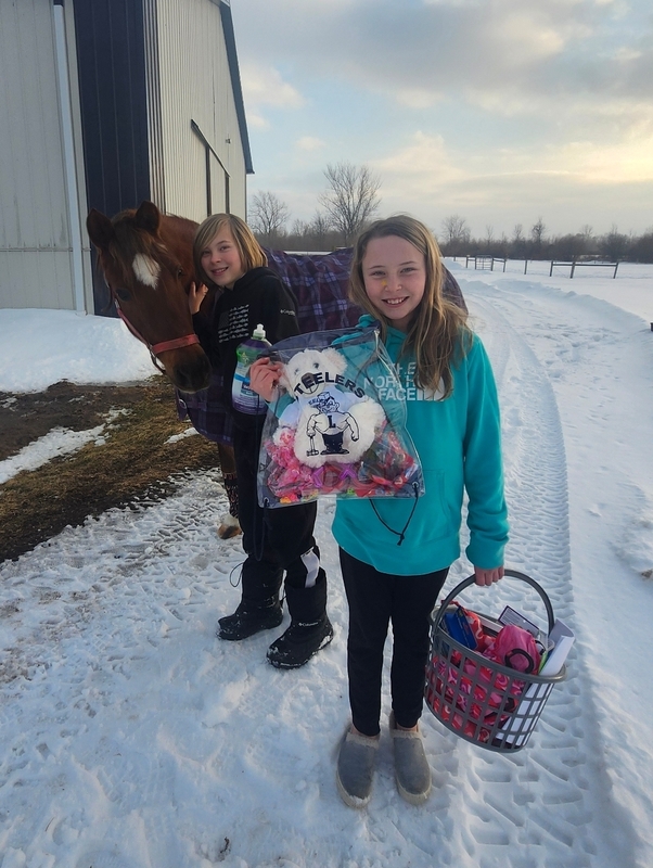 Students carry donation items.