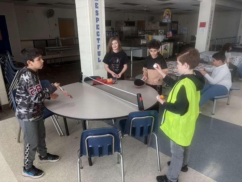 Students play at birthday celebration.