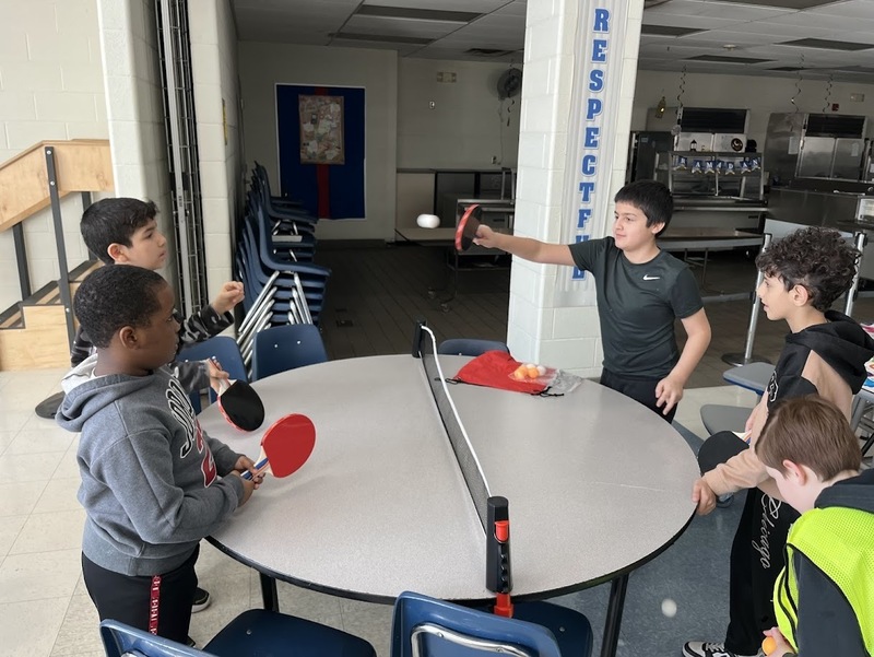 Students play at birthday celebration.