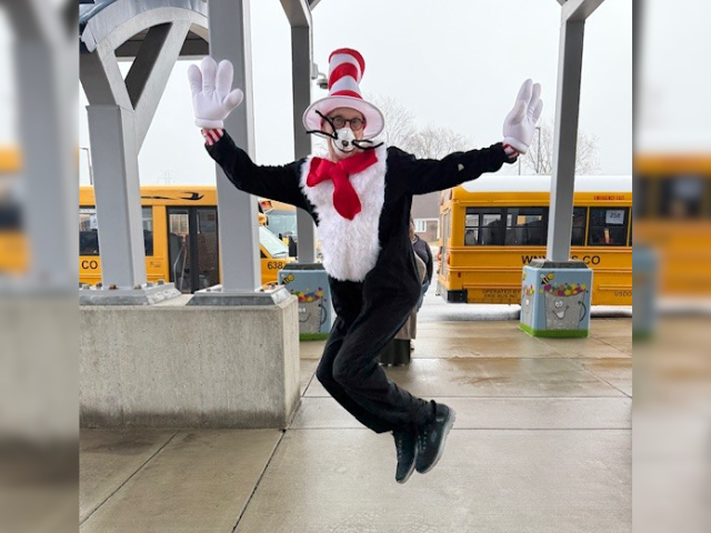 Cat in the Hat poses for a photo.