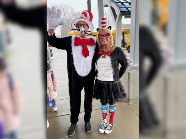 Cat in the Hat poses for a photo.