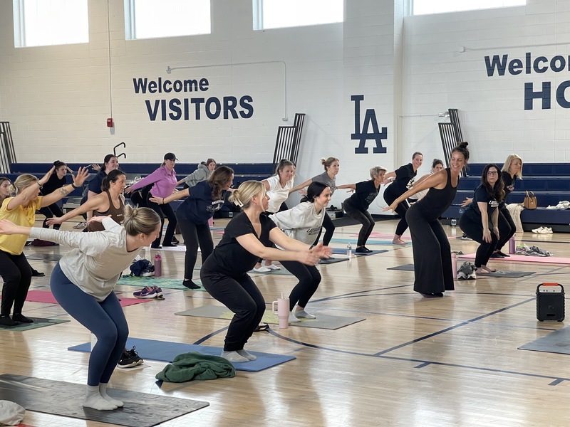 LCSD employees do yoga in the gym.