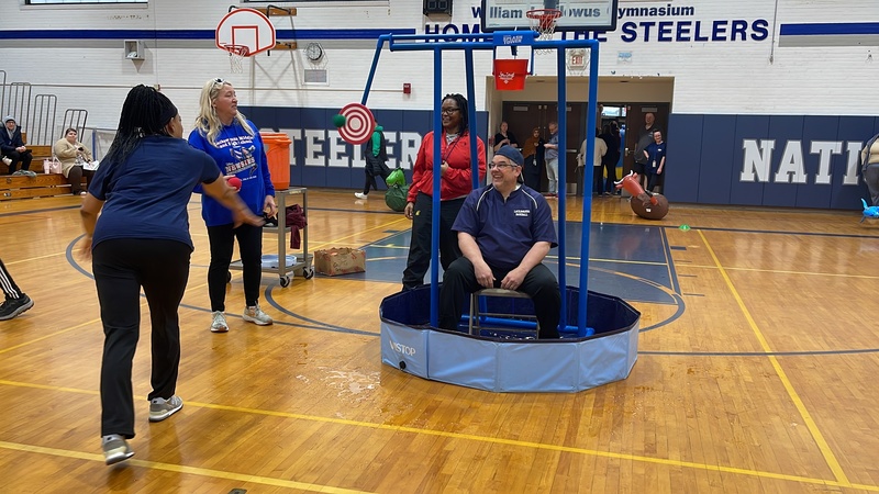 Mr. Axelson gets water dumped on him in the dunk tank.