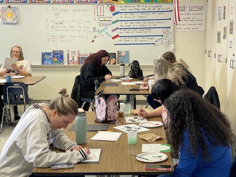 LCSD staff work on painting.