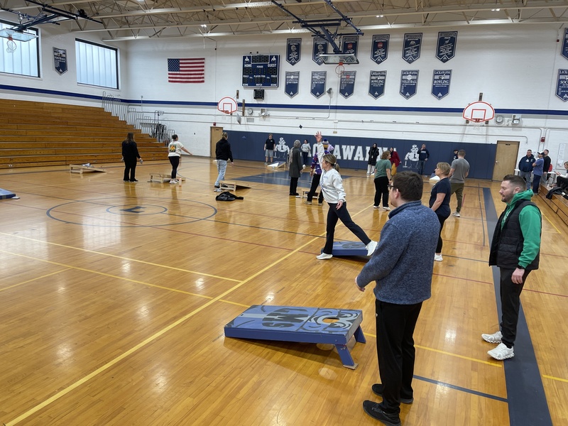 Teachers play cornhole