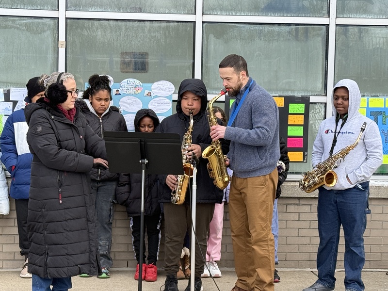 Students perform at playground opening.