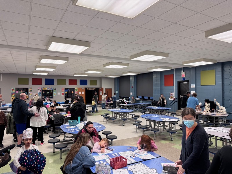 Families participate in STEM and Art Night activities.