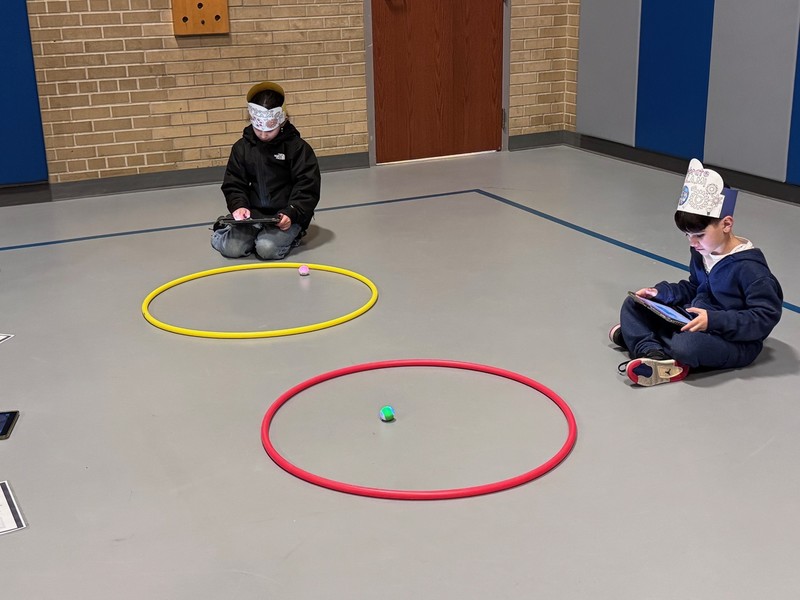 Families participate in STEM and Art Night activities.