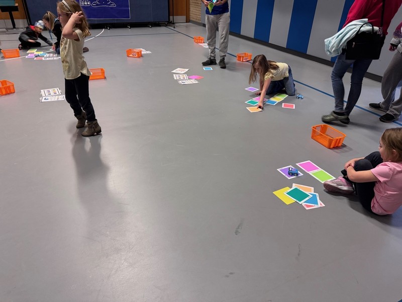 Families participate in STEM and Art Night activities.