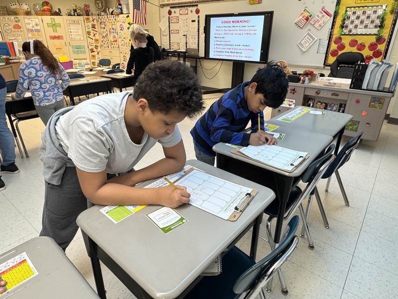 Students work on math in class.