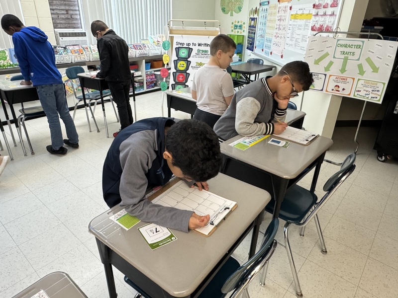 Students work on math in class.