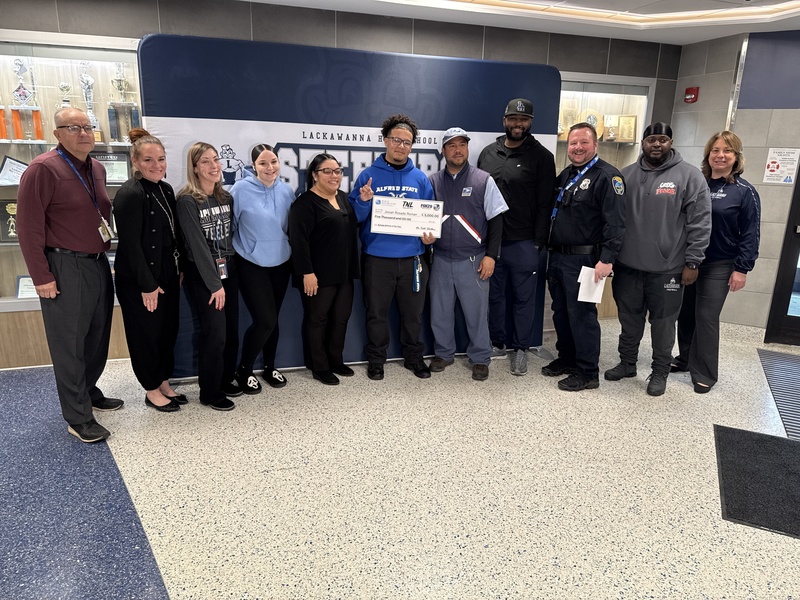 Jossiah poses for a photo with LCSD faculty, staff and family members