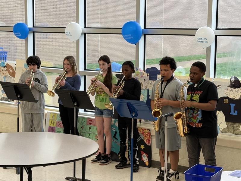 Students play music at opening ceremony.