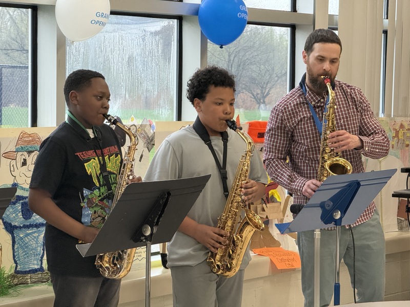 Students play music at opening ceremony.