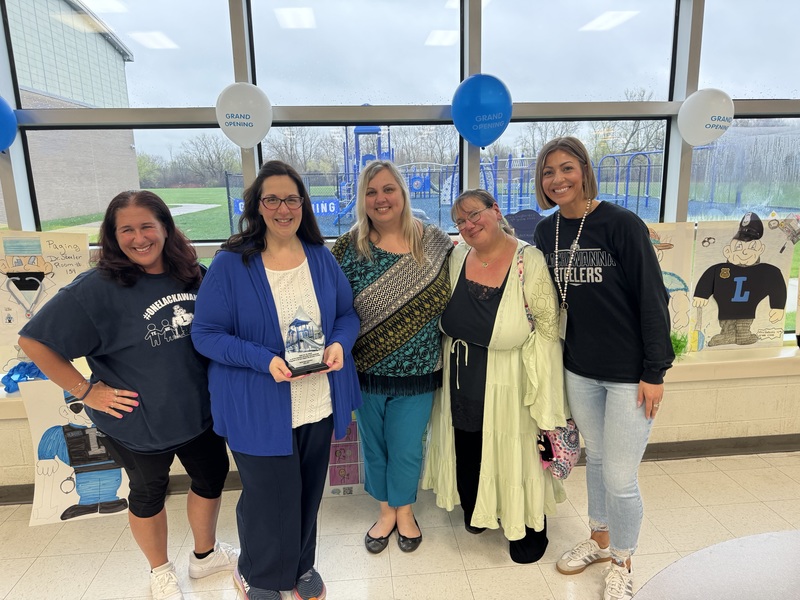 Rosanna stand with teachers.