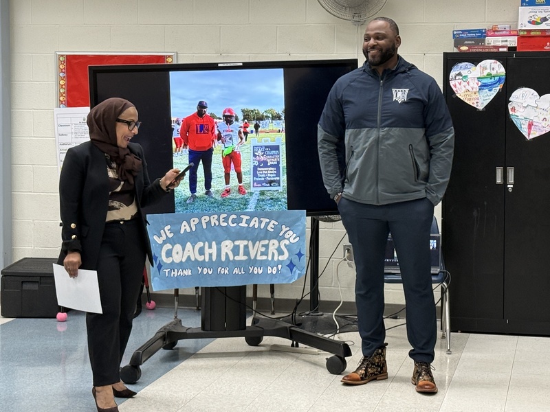 Supt. Nashir stands with Marcus Rivers.