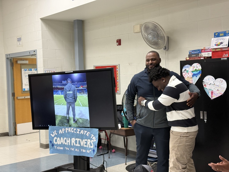 Marcus Rivers stands with his  nephew.