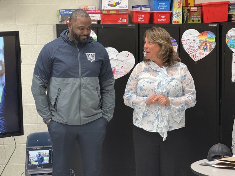 Amy D'Amato stands with Marcus Rivers