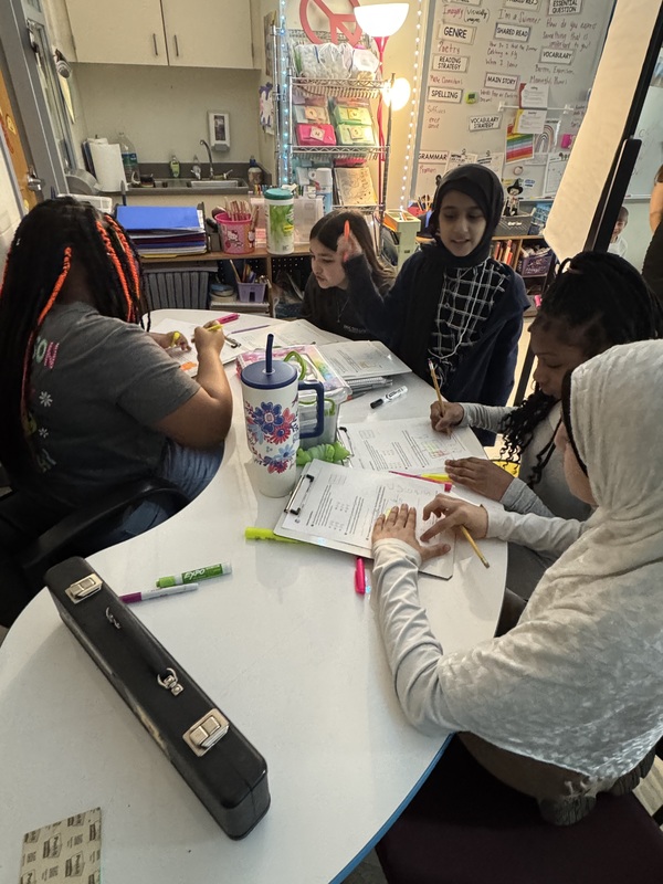 Students work on math in class.