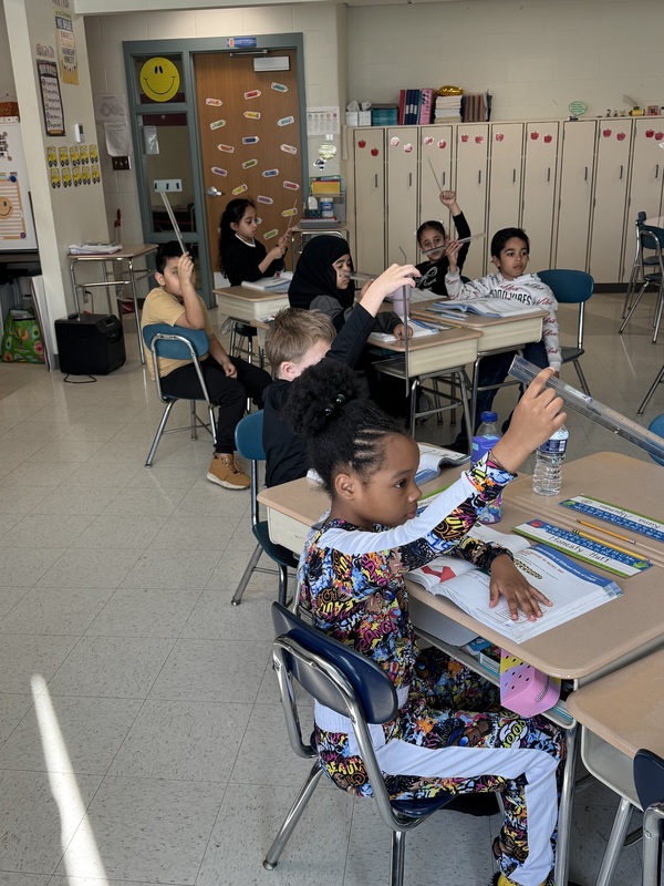 Students work on math in class.