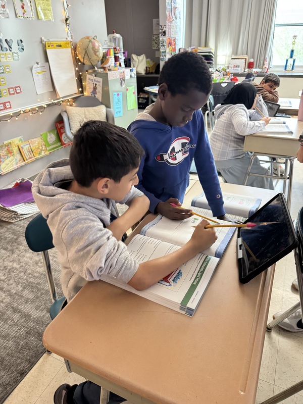 Students learn about liquid volume.
