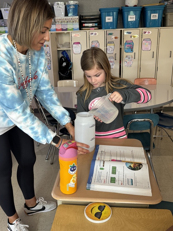 Students learn about liquid volume.