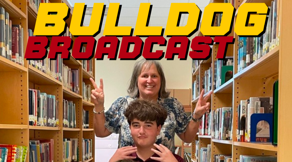 Cover of October Bulldog Broadcast Magazine featuring teacher Addie Duet and two students in a library.