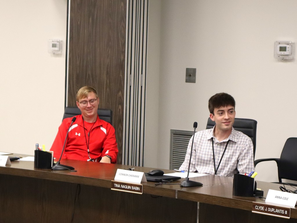 Two male teachers participate in the Employee Advisory Council.