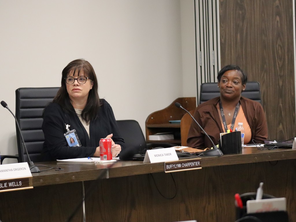 Two female employees participate in the Employee Advisory Council.