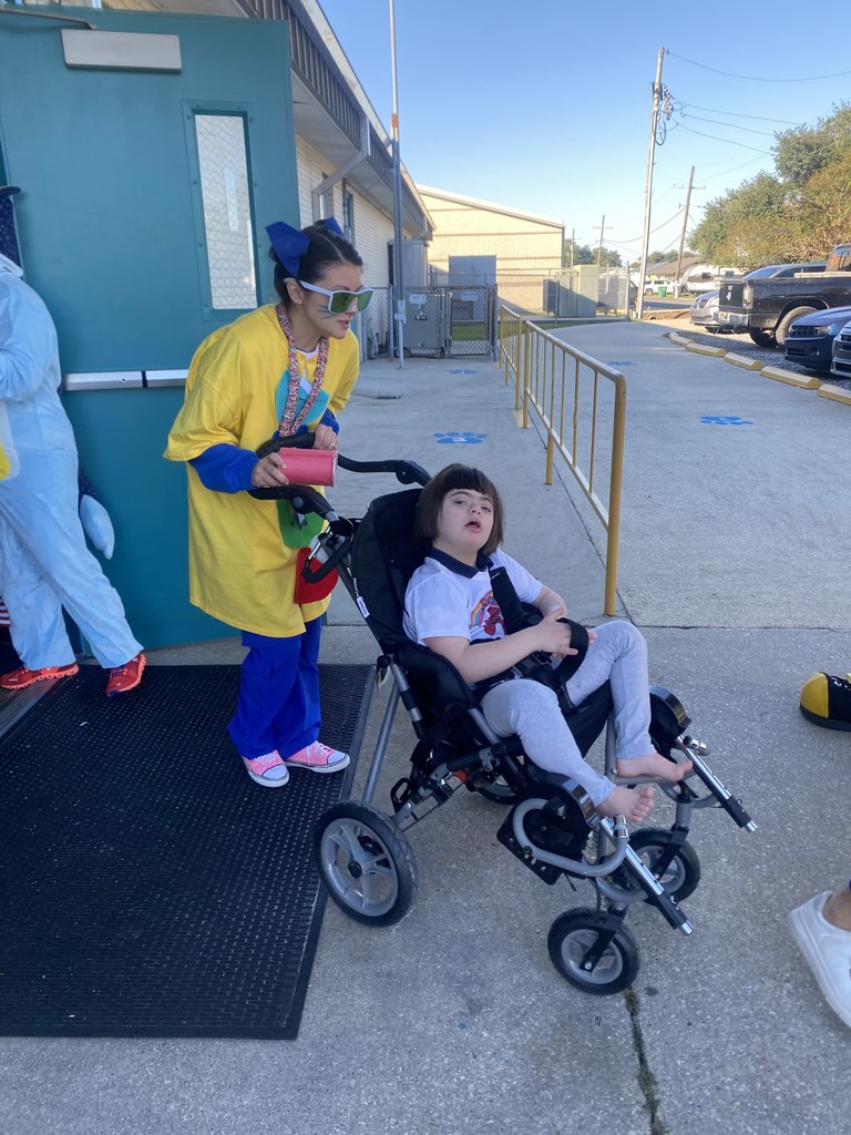 Kids walking out door for parade.