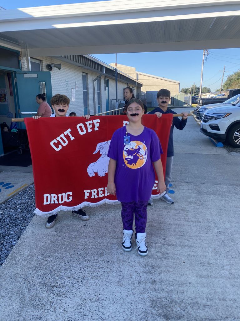 Kids walking out door for parade.