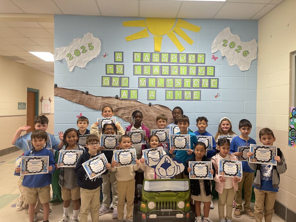 Student with award certificate. 