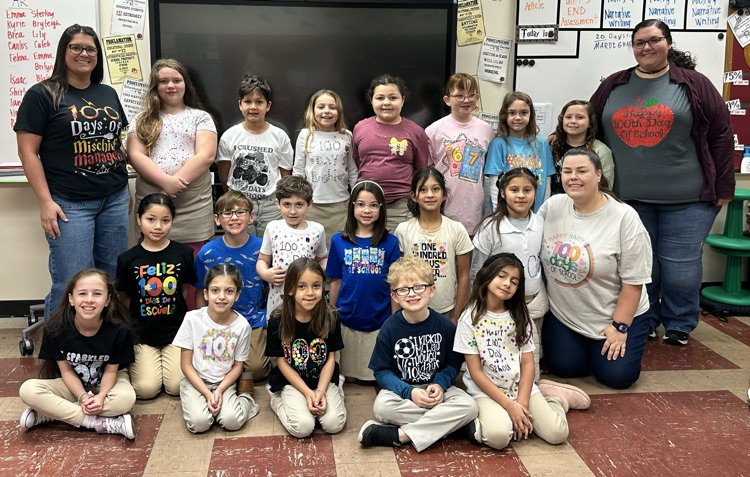Students with 100 day shirts. 