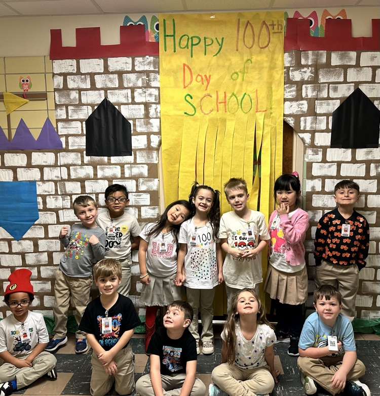 Students with 100 day shirts. 