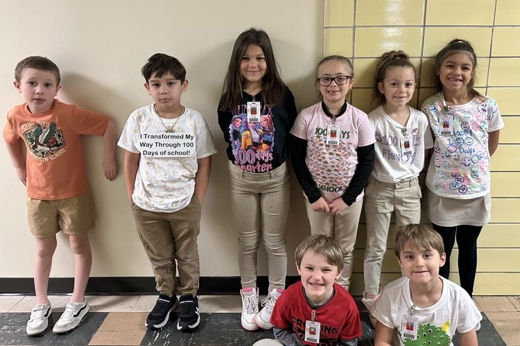 Students with 100 day shirts. 
