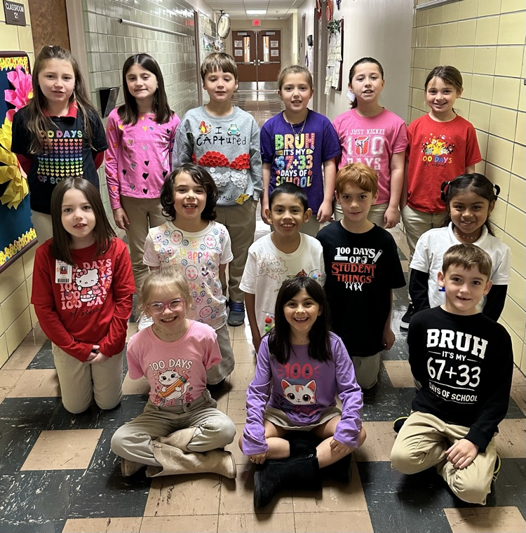 Students with 100 day shirts. 