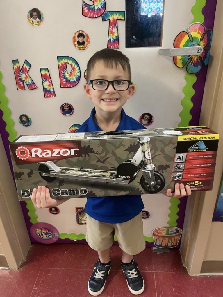 Kaleb guidry - 2nd place coke sale winner with a prize of a scooter