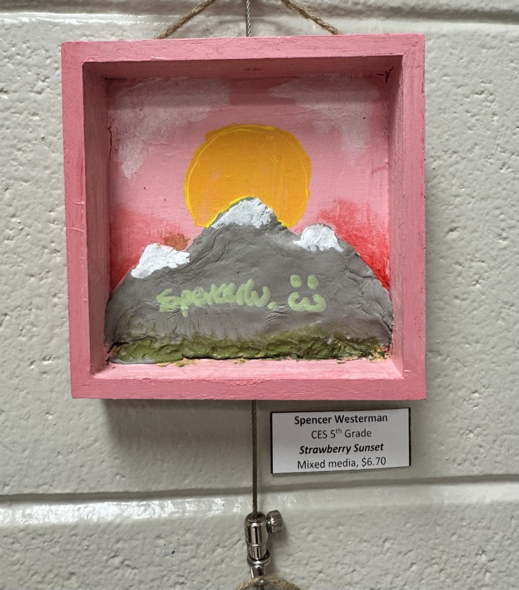 Artwork of mountatins and sun