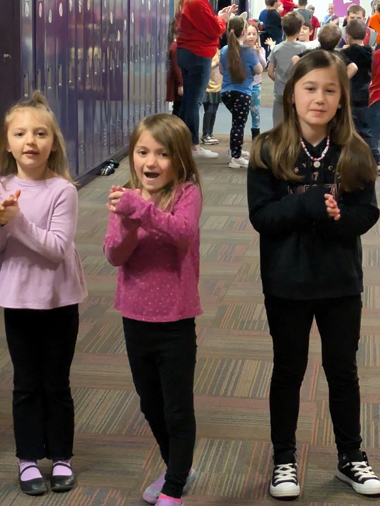 Children dancing in the hallways