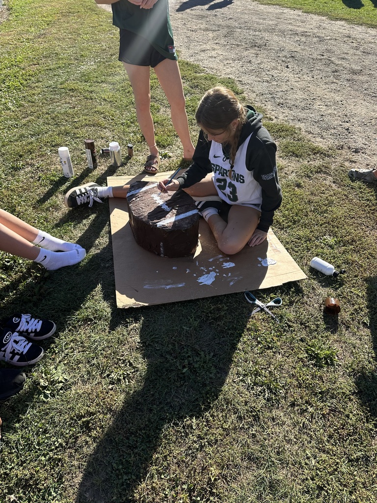 Various images of students building Homecoming parade floats