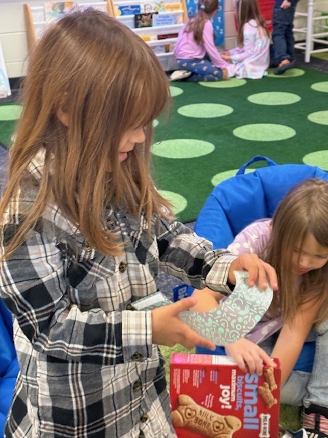 Students playing with their pet center in the classroom