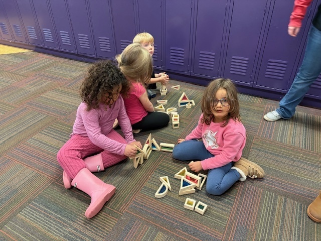 Students playing with blocks as a school reward.